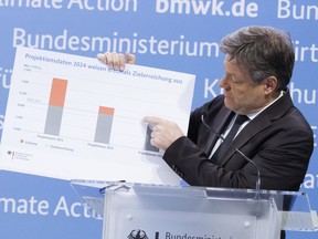 German Vice Chancellor Robert Habeck presents the greenhouse gas emissions data for 2023 and the projection data up to 2030 at a press conference in Berlin, Friday March 15, 2024. Germany's greenhouse gas emissions dropped by one-tenth last year as renewable energy grew in importance, the use of coal and gas diminished and economic pressures weighed on energy demand from business and consumers, official data showed Friday. Habeck, who is also the economy and climate minister, said Europe's biggest economy is on course to meet its target for 2030 of cutting emissions by 65% compared with 1990.