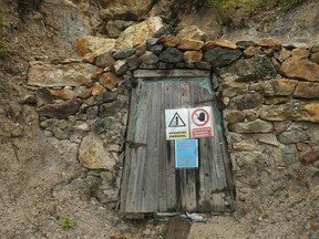 A sign warns visitors of dangers at the Rosia Montana gold mine site in Romania.