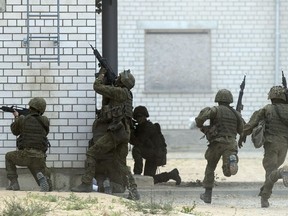 FILE - Soldiers of the NATO enhanced forward presence battalion take part in a military exercise 'Saber Strike 2018' at the Training Range in Pabrade some 60km (38 miles) north of the capital Vilnius, Lithuania, June 11, 2018. The U.S. Congress has passed a bill that involves a total of $228 million in military and defense aid to Estonia, Latvia and Lithuania this year under the Baltic Security Initiative, Estonia's defense officials said Saturday March 23, 2024.