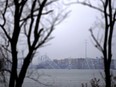 A container ship rests against the wreckage of the Francis Scott Key Bridge on Thursday, March 28, 2024, in Baltimore, Md. After days of searching through murky water for the workers missing after the bridge collapsed, officials are turning their attention Thursday to what promises to be a massive salvage operation.