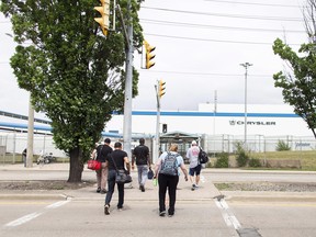 Workers arrive for their shift at the Chrysler assembly plant in Windsor, Ont.