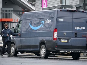 FILE - An Amazon Prime driver makes a delivery in Pittsburgh on Monday, Jan. 23, 2023. The Wisconsin Supreme Court dismissed a lawsuit Tuesday, March 26, 2024, brought by Amazon's logistics subsidiary, which had sought to overturn a lower court's ruling that it had misclassified delivery drivers as independent contractors instead of employees.