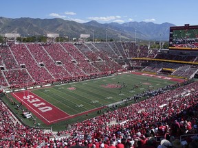 FILE - Weber State and Utah play during an NCAA college football game Rice-Eccles Stadium on Sept. 16, 2023, in Salt Lake City. College athletes in Utah who are looking to profit off their name, image and likeness will have to seek written approval from their school for any business deal exceeding $600 under a bill that received final legislative approval Friday, March 1, 2024, in the state Senate.