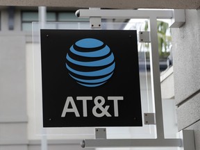 FILE - The sign in front of an AT&T retail store is seen in Miami, July 18, 2019. The theft of sensitive information belonging to millions of AT&T's current and former customers has been recently discovered online, the telecommunications giant said Saturday, March 30, 2024. In an announcement addressing the data breach, AT&T said that a dataset found on the dark web contains information including some Social Security numbers and passcodes for about 7.6 million current account holders and 65.4 million former account holders.