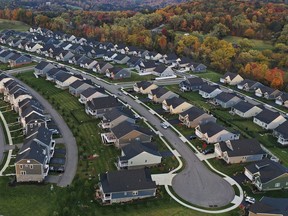 FILE - A new housing development is seen from above, Oct. 12, 2022, in Middlesex Township, Pa. Real estate brokerage company Compass Inc. will pay $57.5 million as part of a proposed settlement to resolve lawsuits over real estate commissions, the company said in a regulatory filing Friday, March 22, 2024.