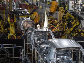 Robots assembling vehicles at a factory in France.