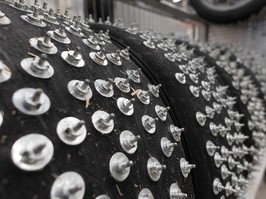 Studded tires for cars participating in an ice track race. Like cars for ice drifting, investors in stock markets should have protections in place to weather collisions.