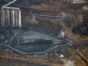 Train cars are loaded with coal at a Teck Resources Elkview Operations steelmaking coal mine in the Elk Valley near Sparwood, British Columbia.