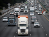 Trucks drive along Interstate 80 in Berkeley, Calif.