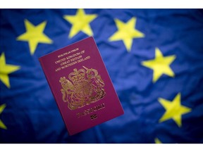 BATH, ENGLAND - OCTOBER 13:  In this photo illustration, a British passport is seen in front of the flag of the European Union on October 13, 2017 in Bath, England. Currency experts have warned that as the uncertainty surrounding Brexit continues, the value of the British pound, which has remained depressed against the US dollar and the euro since the UK voted to leave in the EU referendum, is likely to fluctuate.