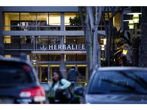 A person walks towards the entrance to Herbalife Ltd. Plaza in Torrance, California, U.S., on Tuesday, Feb. 20, 2018. Herbalife Ltd. is scheduled to release earnings figures on February 22. Photographer: Patrick T. Fallon/Bloomberg