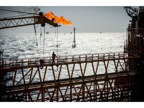 A gas flare burns from a pipe aboard an offshore oil platform in the Persian Gulf's Salman Oil Field, operated by the National Iranian Offshore Oil Co., near Lavan island, Iran, on Thursday, Jan. 5. 2017. Nov. 5 is the day when sweeping U.S. sanctions on Iran's energy and banking sectors go back into effect after Trump's decision in May to walk away from the six-nation deal with Iran that suspended them. Photographer: Ali Mohammadi/Bloomberg