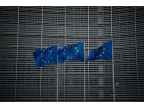 BRUSSELS, BELGIUM - MARCH 02: European flags are seen outside the European Commission on March 02, 2020 in Brussels, Belgium. The UK chief negotiator David Frost has met his EU counterpart Michel Barnier to begin formal negotiations of the future relationship between the EU and UK.