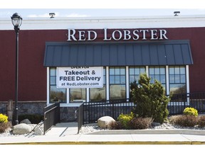 A banner saying "Open For Takeout & Free Delivery" hangs outside a Red Lobster restaurant at The Plaza at Harmon Meadow in Secaucus, New Jersey, U.S., on Thursday, April 2, 2020.