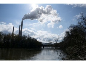 Emissions rise from a smoke stack at the Conesville Power Plant in Conesville, Ohio, U.S., on Saturday, April 18, 2020. The Trump administration on Thursday attacked the legal basis of requirements to capture mercury and other heavy metal pollution from power plants, setting the stage for a court to potentially toss out the mandates altogether. Photographer: Dane Rhys/Bloomberg