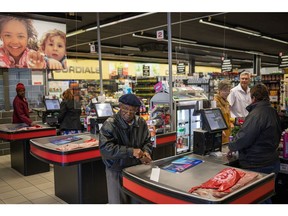 Shoppers at a supermarket in Frankfort, South Africa. Photographer: Michele Spatari/Bloomberg