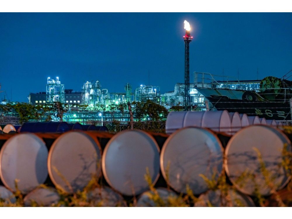 Storage drums stacked in the Keihin industrial area of Kawasaki, Kanagawa Prefecture, Japan, on Wednesday, Oct. 11, 2023. Oil dropped for a third day, erasing all of the surge on Monday that followed Hamas' attack on Israel over the weekend. Photographer: Toru Hanai/Bloomberg