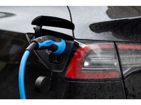An electric vehicle charges. Photographer: Benjamin Girette/Bloomberg