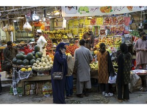 Shoppers buy fruits at a market in Islamabad, Pakistan, on Saturday, March 30, 2024. Pakistan is scheduled to release consumer price index (CPI) figures on April 1. Photographer: Asad Zaidi/Bloomberg