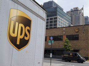 FILE - A delivery vehicle passes by a UPS depot, Thursday, June 29, 2023, in New York. UPS has received an air cargo contract from the United States Postal Service, significantly expanding on an existing partnership between the two. UPS said Monday, April 1, 2024, that it will become USPS's primary air cargo provider and move the majority of its air cargo in the U.S. following a transition period.