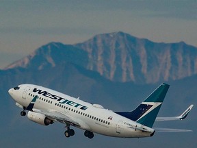 A WestJet Boeing 737 after take-off from the Calgary International Airport.