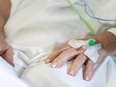 Person in hopsital receiving intravenous drug