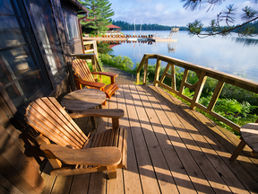 Chairs on the porch of a lakeside cottage