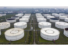 Oil storage tanks are seen in this aerial photograph taken on the outskirts of Ningbo, Zhejiang Province, China. Photographer: Qilai Shen/Bloomberg