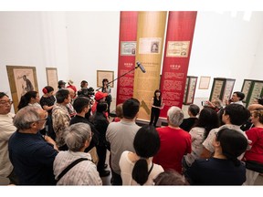 Curator Catherine Clement presenting the Chinese Canadian Museum's feature exhibition "The Paper Trail to the 1923 Chinese Exclusion Act" during the museum's grand opening on July 1, 2023.