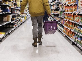 A customer browses an aisle at a grocery store In Toronto on Friday, Feb. 2, 2024. A labour expert says Unifor has achieved an "important victory" after grocery workers at 11 Dominion stores in Newfoundland ratified a new deal Monday.