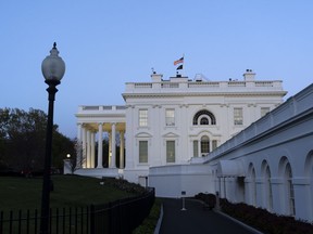 The White House is seen as dusk falls, Sunday, April 14, 2024, in Washington.