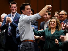 Minister of Finance Chrystia Freeland gets a shout-out from Prime Minister Justin Trudeau during a caucus meeting on Parliament Hill in Ottawa on Wednesday.