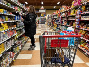 A person shops at a grocery store