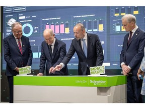 Olaf Scholz, Chancellor of Germany, and Jonas Gahr Støre, Prime Minister of Norway, meeting with Peter Herweck, CEO of Schneider Electric, at the Hannover Messe 2024 event.