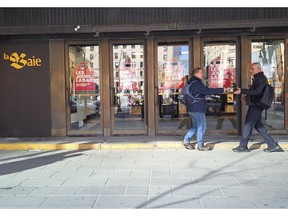 Members of the United Steelworkers union (USW) leaflet outside the Hudson's Bay store in Monteal.