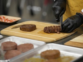 Plant-based steak product is cut up in a test kitchen in Boulder, Colo., on July 26, 2023. Industry experts say the plant-based protein industry is focused on improving the price, taste and texture of its products as it weathers a period of consumer wariness brought on by the rising cost of living.