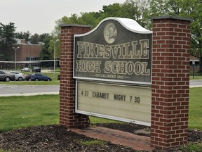 Signage is shown outside on the grounds of Pikesville High School, May 2, 2012, in Baltimore County, Md. The most recent criminal case involving artificial intelligence emerged in late April 2024, from the Maryland high school, where police say a principal was framed as racist by a fake recording of his voice.
