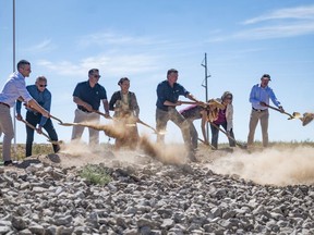 FILE - Dignitaries, including U.S. Secretary of the Interior Deb Haaland, center, break ground on the new SunZia transmission line project, Sept. 1, 2023, in Corona, N.M. A federal judge on Tuesday, April 16, 2024, rejected a request by Native American tribes and environmentalists to stop work on the $10 billion transmission line being built through a remote southeastern Arizona valley that will carry wind-generated electricity from New Mexico to customers as far away as California.