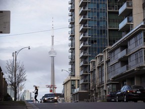 The CN Tower behind condos in Liberty Village in Toronto.