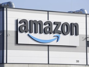 An Amazon company logo is seen on the facade of a company's building in Schoenefeld near Berlin, Germany, on March 18, 2022. Unifor says it's temporarily withdrawing its applications to represent workers at two Vancouver-area Amazon centres, accusing the digital retail giant of providing a "suspiciously high" employee count.