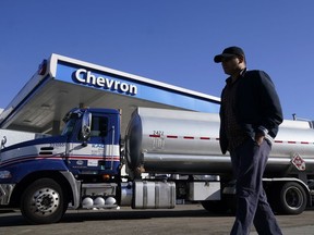 FILE - A man walks past a tanker at a Chevron gas station in San Francisco, Oct. 23, 2023. On Thursday, April 11, 2024, the Labor Department releases producer prices data for March.