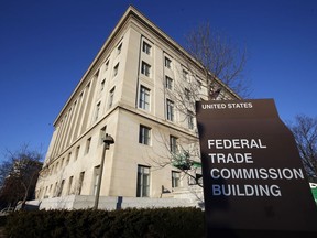 FILE - The Federal Trade Commission building is seen, Jan. 28, 2015, in Washington. U.S. companies would no longer be able to bar employees from taking jobs with competitors under a rule approved by the FTC on Tuesday, April 23, 2024, though the rule seems sure to be challenged in court.