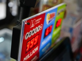 A sign for the Powerball jackpot is displayed at a 7-Eleven, Friday, April 5, 2024, in Portland, Ore.