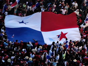 People display a Panamanian national flag