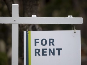 A new report says the asking rent for a home in Canada in March was up 8.8 per cent compared with a year ago, but down from February. A rental sign is seen outside a building in Ottawa, Thursday, April 30, 2020.