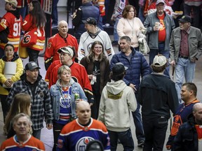 Crowds walk through the concourse before the start of a Calgary Flames game in Calgary, Saturday, April 6, 2024.