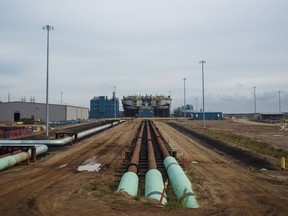 Pipes lie on the ground at an oilsands extraction site