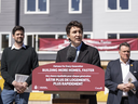 Prime Minister Justin Trudeau, centre, is flanked by Minister of Housing, Infrastructure and Communities Sean Fraser, left, and the Mayor of Halifax, Mike Savage, while making a housing announcement in Dartmouth, N.S. on Tuesday, April 2, 2024. Trudeau has been making housing announcements all week in the run-up to the federal budget on April 16.