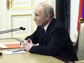 Russian President Vladimir Putin chairs a Security Council meeting in Moscow, Russia, Thursday, April 11, 2024.