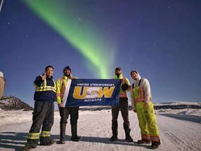 USW members at Parsons Inc. in Faro, Yukon celebrate joining the United Steelworkers union under the Northern Lights.